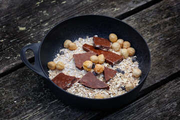 Porridge with nuts, chocolate and raisins for an active lifestyle