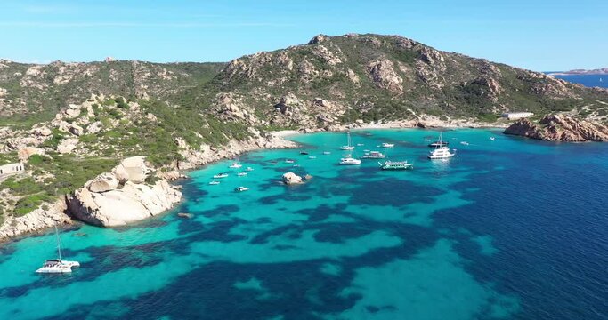 Aerial view of Spargi Island with Cala Corsara, a white sand beach bathed by a turquoise water in La Maddalena Archipelago, Sardinia, Italy.