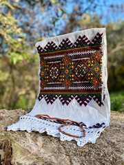 Embroidered towel - with an ancient folk Western Ukrainian ornament and a coral necklace.