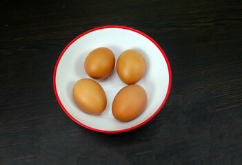 Eggs placed in a Red Bowl