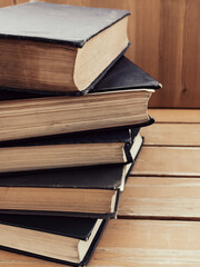 Close-up of stack of old books on the table