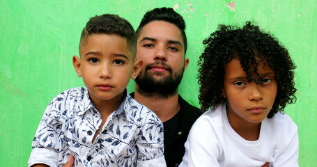 Hispanic father with kids. Brazilian people, serious expression. south american latin ethnicity