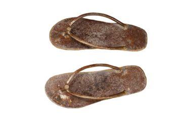 Rusted sheet metal scraps are recycled into slippers.