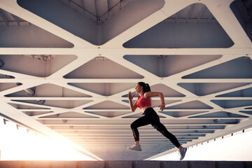 Fototapeta na wymiar Fitness woman running outdoors