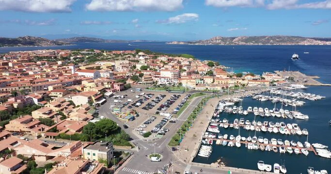 Aerial view of the port of Palau with a ferry headed to the La Maddalena in the Costa Smeralda area of Sardinia, Italy.