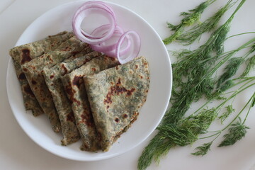 Dil Paratha. Simple and healthy Indian flat bread made of whole wheat flour, finely chopped dil leaves, yogurt and spices.