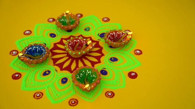 Yellow color background design for Diwali festival with beautiful lamps. Decorative colorful lamps during Diwali festival.