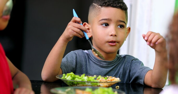 Hispanic Child Eating Lunch. South American Kids Eat Meal Salad