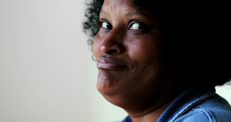 Hispanic black woman laughing, real life emotional reaction. Real people