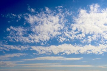 The clouds in the blue sky.