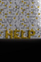 Gold word help on octagonal gray background.