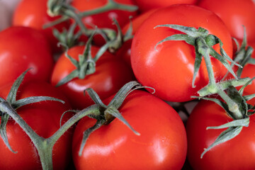 cherry tomatoes with green twigs.