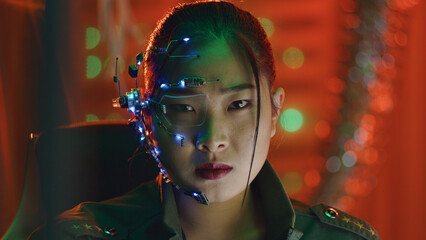 A Cyberpunk girl looks at the computer screen. Wearing futuristic one-eyed glasses with microphone....