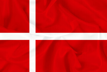 Beautiful national red and white flag of Denmark on fabric background