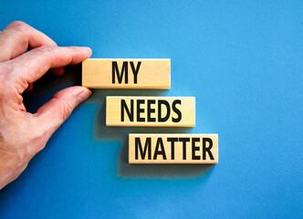 My needs matter symbol. Concept words My needs matter on wooden blocks. Businessman hand. Beautiful blue table blue background. Business, psychological and my needs matter concept. Copy space.