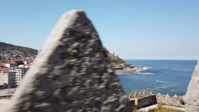 DOLLY SHOT - The Monterreal Fortress on the Monte Boi peninsula in the Galician village of Baiona, Galicia, Spain.