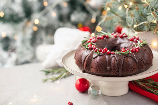 Christmas chocolate bundt cake decorated cranberries and rosemary