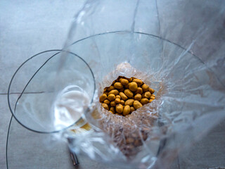 Beer with peanuts. Raw peanuts in a plastic bag.
