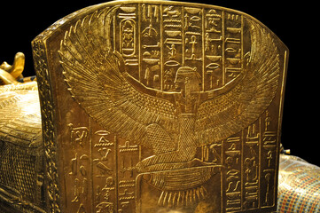 Golden sarcophagus of a pharaoh with Egyptian hieroglyphics