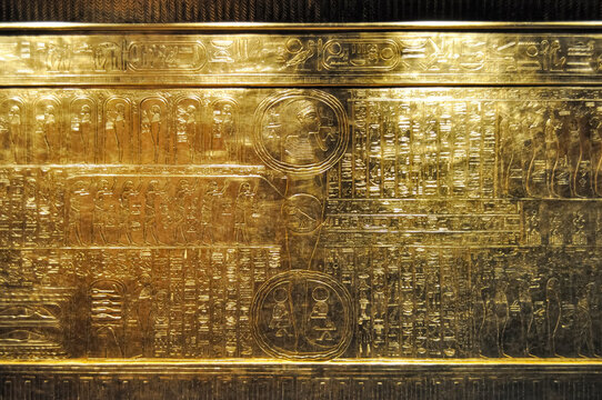 Golden wall with Egyptian hieroglyphics
