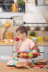 Child and sugar, sweets. Giving up the sweet. Happy baby, boy with apple. Health of child, healthy diet, healthy food, nutrition, harmful and healthy meal. Child love fruits, apple. Child and snaсkes