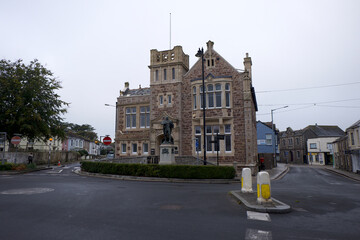 Camborne Cornwall UK 10 18 2022 Passmore Edwards library of 1895 with statue of Trevithick. Edwards was a Cornish born philanthropist who funded several public buildings accross Cornwall. 