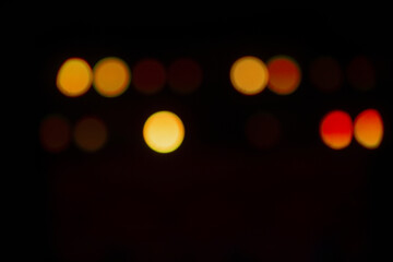 Stage lighting. Spotlights with colored lights on a stage. Artificial lighting. Black background and blur.