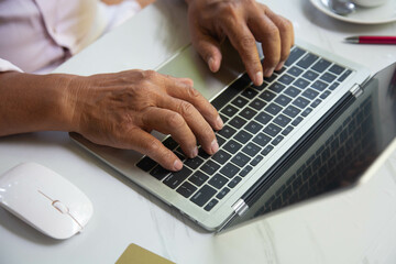 Business man studying trading and investing information for future online sales.