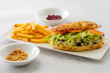 Chicken Cranberry Sandwich with salad and french fries served in a dish isolated on background side view of fastfood