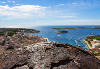 An old rusty cannon on the spanish fortress. In the background the port of Hvar (Dalmatia, Croatia)...