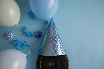 Dumbbells barbell weight plate with cone shaped hat, blue balloons and ribbons. Gym exercise...