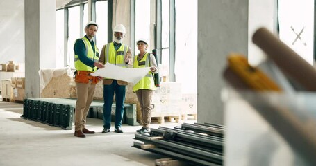 Building, construction and architect with a team working on site while reading a blueprint or plans indoors. Teamwork, engineer and architecture with a man and woman contractor group in collaboration
