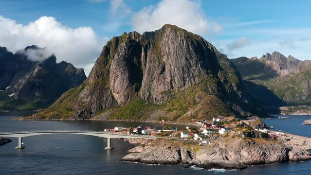 Aerial drone view of Hamnoy in Lofoten islands in Norway on a sunny day. Fjords and mountains at sunset 