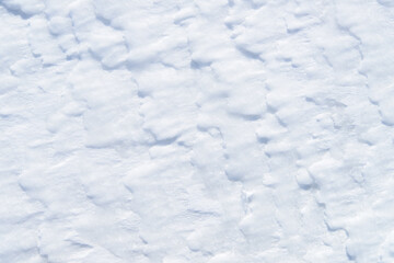 Background of fresh snow, blue shadows