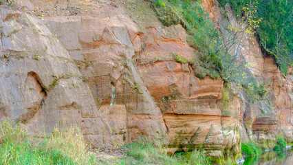 Sandy stones on the bank of the river Gauja. Autumn nature in Latvia. Gaujas national park.