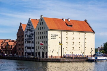 Naklejka premium Narodowe Muzeum Morskie building on the bank of Stara Motlawa river