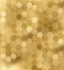 A pattern of hexagonal cells in gold color close-up