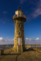 Obraz premium The Stone Lighthouse on the East Pier, Whitby, North Yorkshire