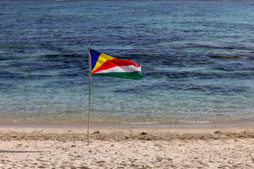 Seychelles flag on the beach