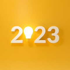 Bulb light with new year 2023 on yellow background.