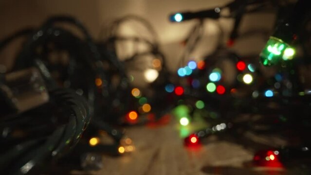 Light bulb decor, the string of lights on a dark background. Christmas garland, light bulbs.