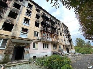 Fototapeta na wymiar Destroyed and damaged residential buildings in Hostomel after Russia's invasion of Ukraine