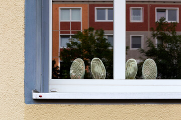 Two pairs of shoes in a window, Berlin-Friedrichshain, Germany