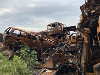 Fototapeta premium A bunch of burned and shelled cars in Hostomel in the Kyiv region
