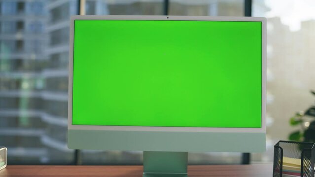 Green screen template monitor at workplace closeup. Mockup pc computer interior