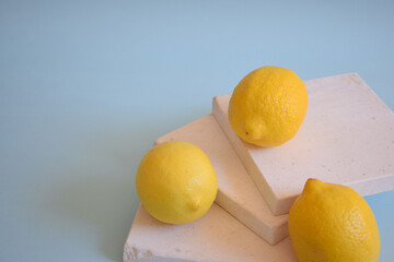 Fresh lemons on a blue background