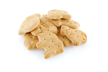 Cookies in the form of animals on a white background. Heap of delicious crispy zoological biscuits. Full depth of field.