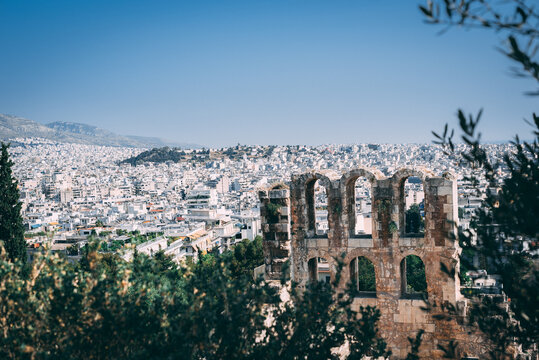 Athens Skyline: Fragment of Collapsing Building Amidst Mediterranean Urban Panorama