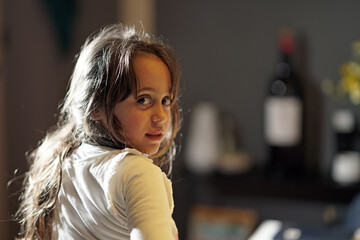 Fototapeta premium Young girl 6-7 years old looks to the side
