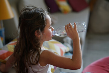 Young girl 6-7 years old drinking
